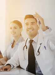 Image showing group of happy doctors on conference at hospital