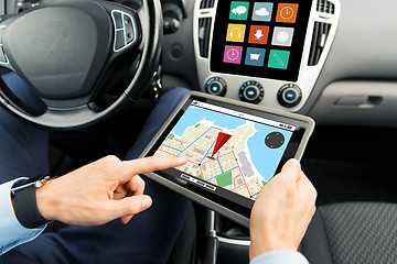 Image showing close up of man with tablet pc in car