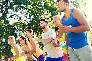 Image showing sportsmen with badge numbers on start of race