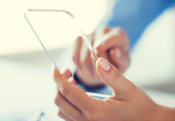 Image showing close up of woman with transparent smartphone