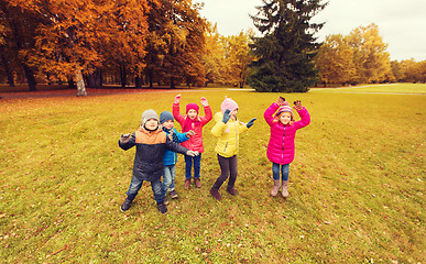 Image showing group of happy children having fun in autumn park