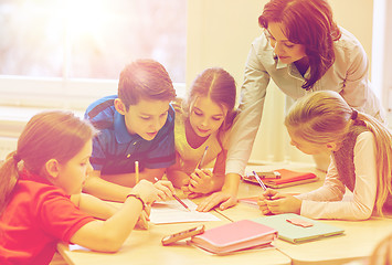 Image showing group of school kids writing test in classroom