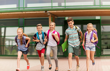 Image showing group of happy elementary school students running