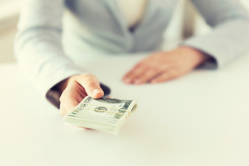 Image showing close up of woman hands holding us dollar money