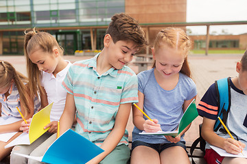 Image showing group of happy elementary school students outdoors