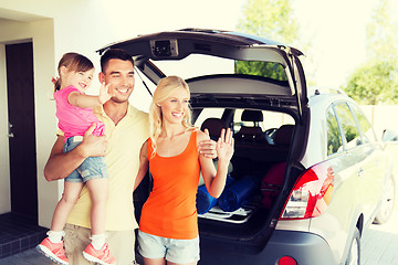 Image showing happy family with hatchback car at home parking