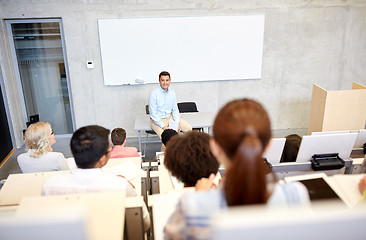 Image showing group of students and teacher at lecture