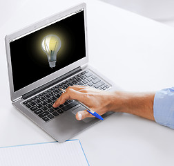 Image showing businessman with laptop computer working at office