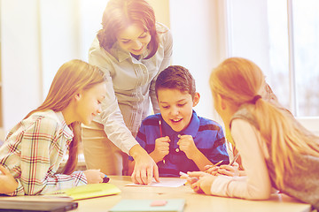 Image showing group of school kids writing test in classroom