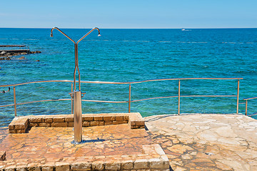 Image showing Shower on the rocky beach in Istria