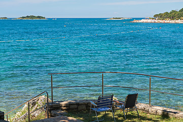 Image showing Rocky beach with two chairs in Istria