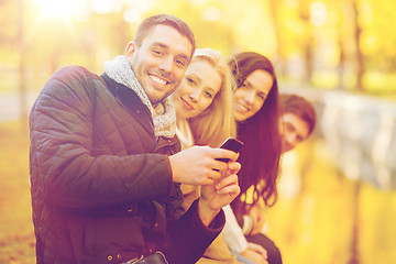 Image showing group of friends having fun in autumn park