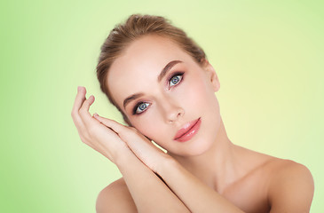 Image showing beautiful young woman face and hands