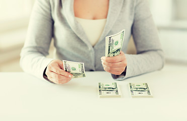 Image showing close up of woman hands counting us dollar money