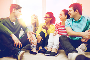 Image showing five smiling teenagers having fun at home