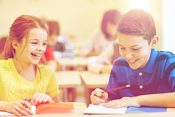 Image showing group of school kids writing test in classroom