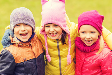 Image showing group of happy children hugging in autumn park