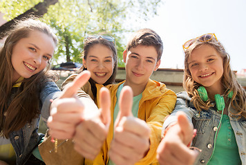 Image showing teenage friends or students showing thumbs up