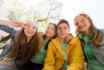 Image showing happy teenage students or friends having fun