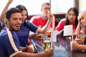 Image showing fans or friends watching football at sport bar
