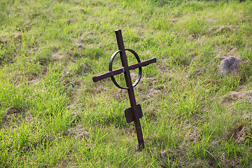 Image showing old rusty grave cross on cemetery in ireland