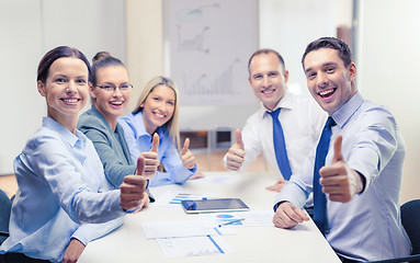 Image showing business team showing thumbs up in office