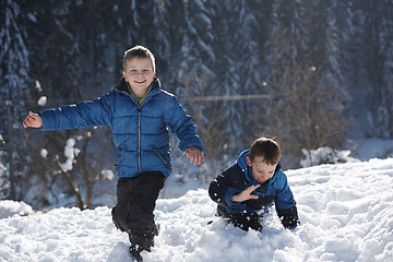 Image showing kids playing with  fresh snow