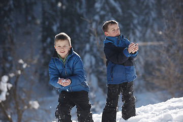 Image showing kids playing with  fresh snow