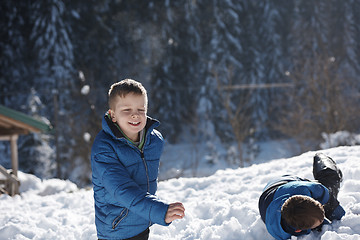 Image showing kids playing with  fresh snow