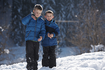 Image showing kids playing with  fresh snow