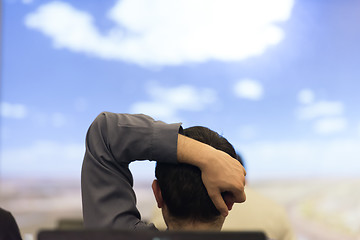 Image showing young man dreaming clouds on presentation