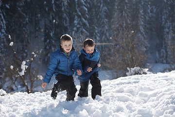 Image showing kids playing with  fresh snow