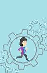 Image showing Business woman running inside the gear.