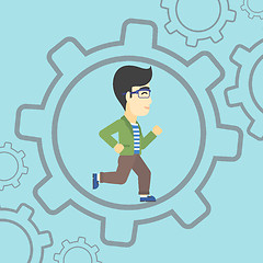 Image showing Businessman running inside the gear.