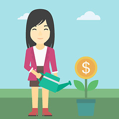 Image showing Business woman watering money flower.