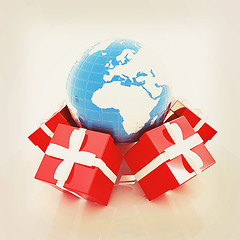 Image showing Traditional Christmas gifts and earth. Global holiday concept . 