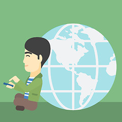 Image showing Businessman sitting near Earth globe.