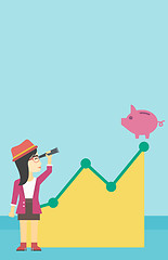 Image showing Business woman looking at piggy bank.