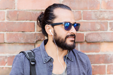 Image showing happy man with earphones listening to music