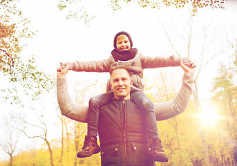 Image showing happy family having fun in autumn park