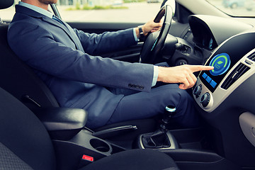 Image showing close up of man  driving car in eco mode