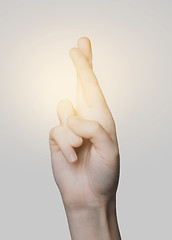 Image showing close up of hand showing two cross fingers