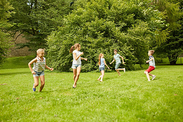 Image showing happy kids running and playing game outdoors