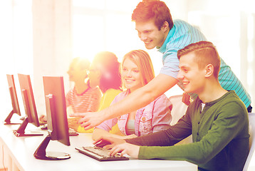 Image showing smiling students in computer class at school