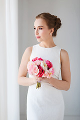 Image showing bride or woman in white dress with flower bunch