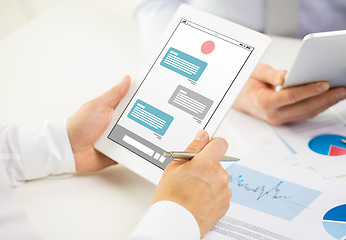 Image showing close up of businessman and messenger on tablet pc