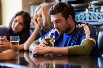 Image showing football fans or friends with beer at sport bar