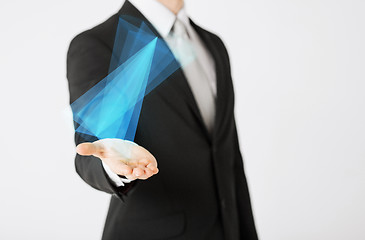 Image showing close up of businessman showing virtual hologram