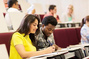 Image showing group of students with notebooks in lecture hall