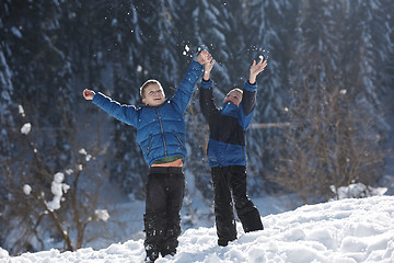 Image showing kids playing with  fresh snow